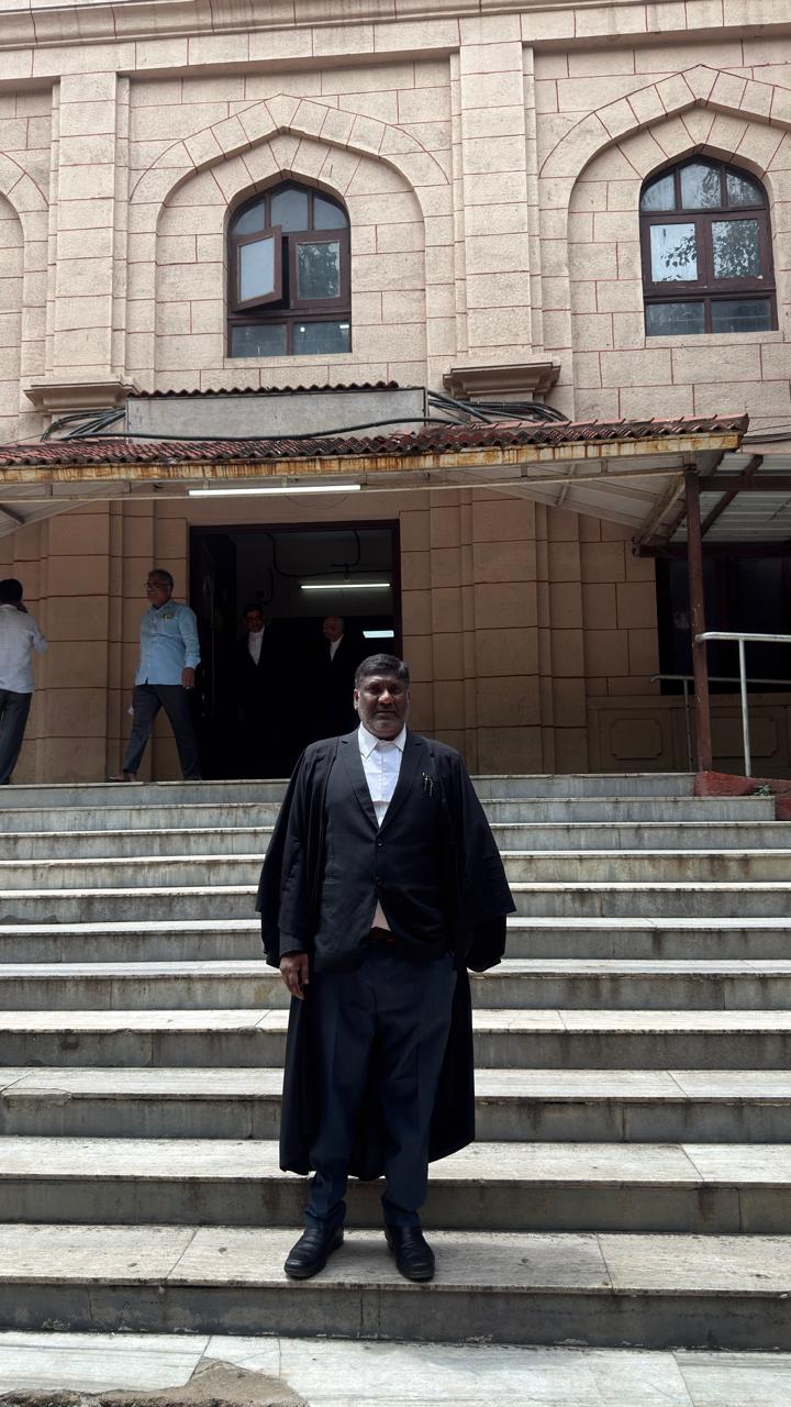 Advocate in robes at the court entrance